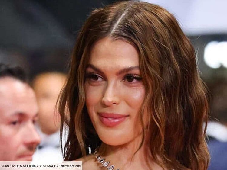 Iris Mittenaere, éblouissante dans une robe transparente perlée de strass, défile sur le tapis rouge de Cannes